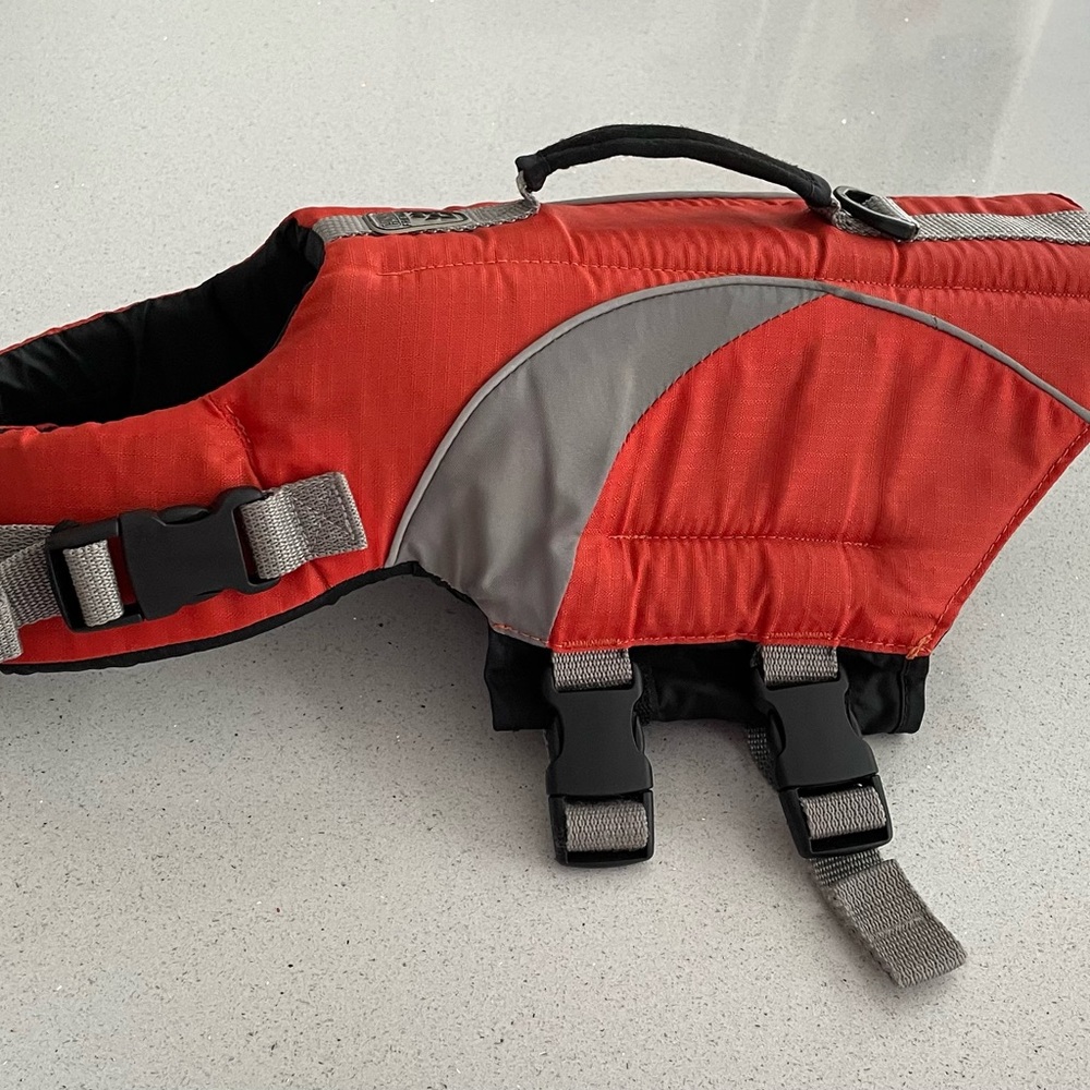 Used pet life jacket. Size small.